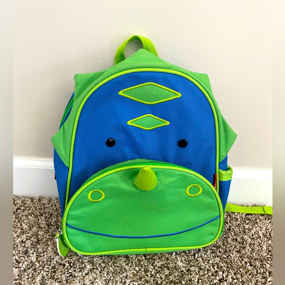 Adorable SkipHop kids dinosaur backpack, in gently used but great condition